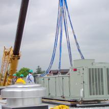 Crane hoisting HVAC unit